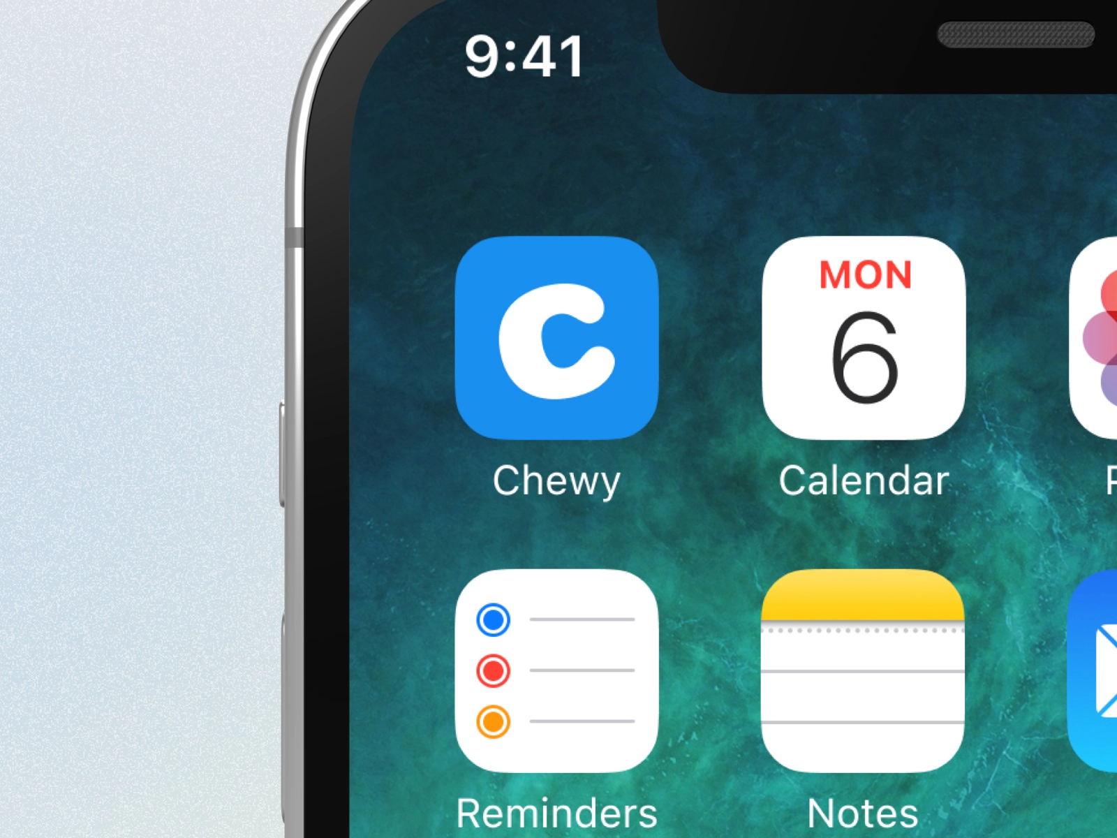 A thumbnail of a phone screen displaying a blue app icon for the Chewy app surrounded by stock iOS apps on the homescreen.